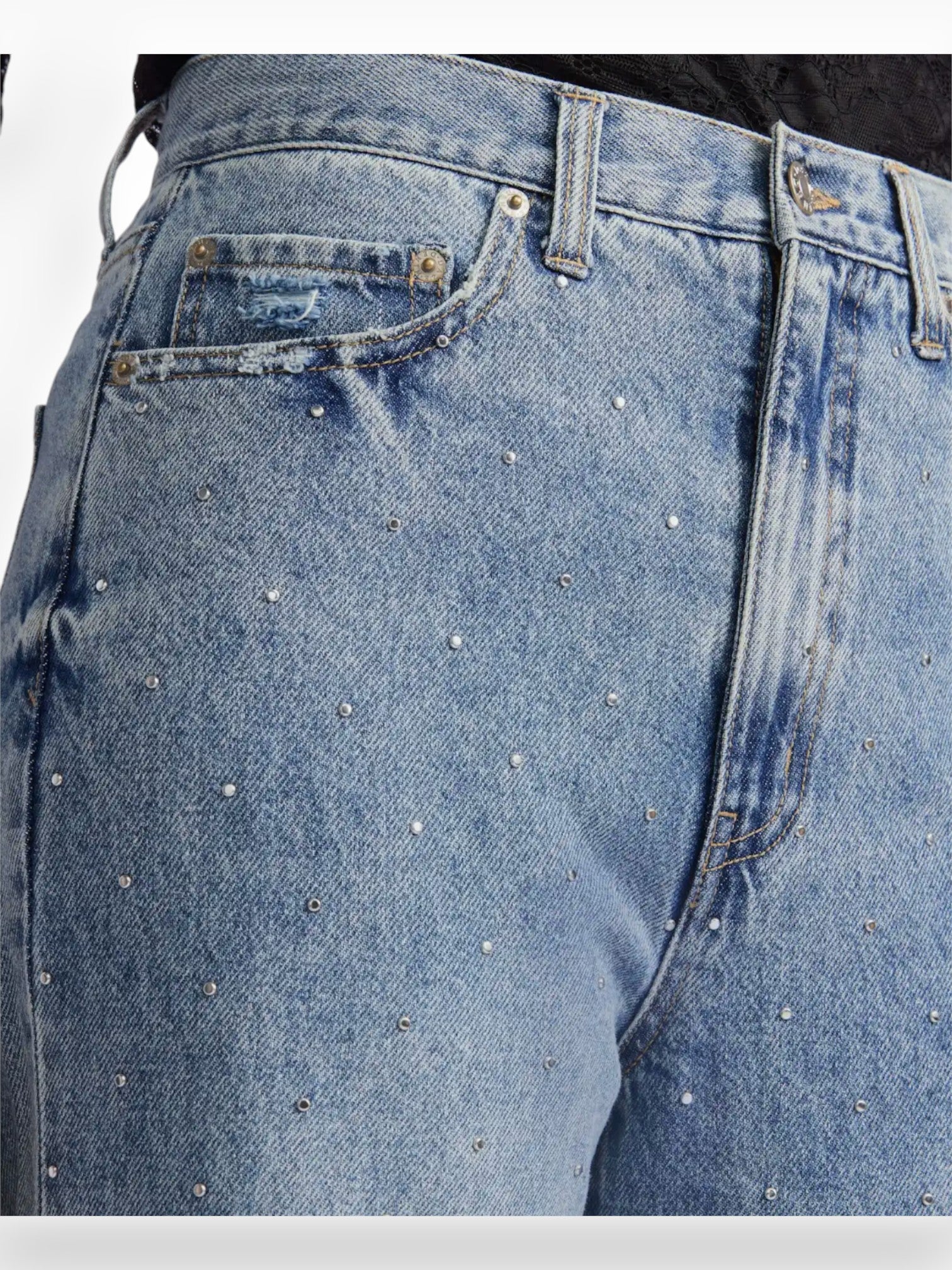 Close-up of Daze Denim Far Out High Rise Studded Jeans showcasing sparkling crystal details on classic blue denim fabric.