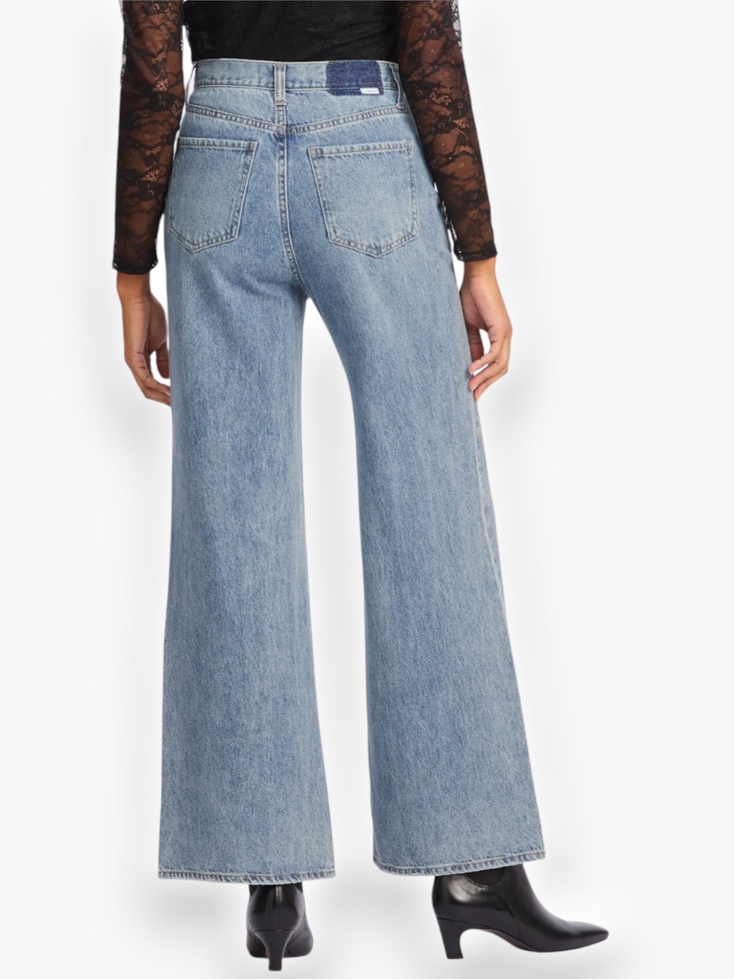 Back view of Daze Denim Far Out High Rise Studded Jeans with a flattering high-waisted fit and wide-leg silhouette.