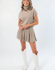 Call Me Back Skirt Set-Dark Taupe Knit features a cozy turtleneck top and pleated mini skirt. Perfect fall outfit for day or night styling.