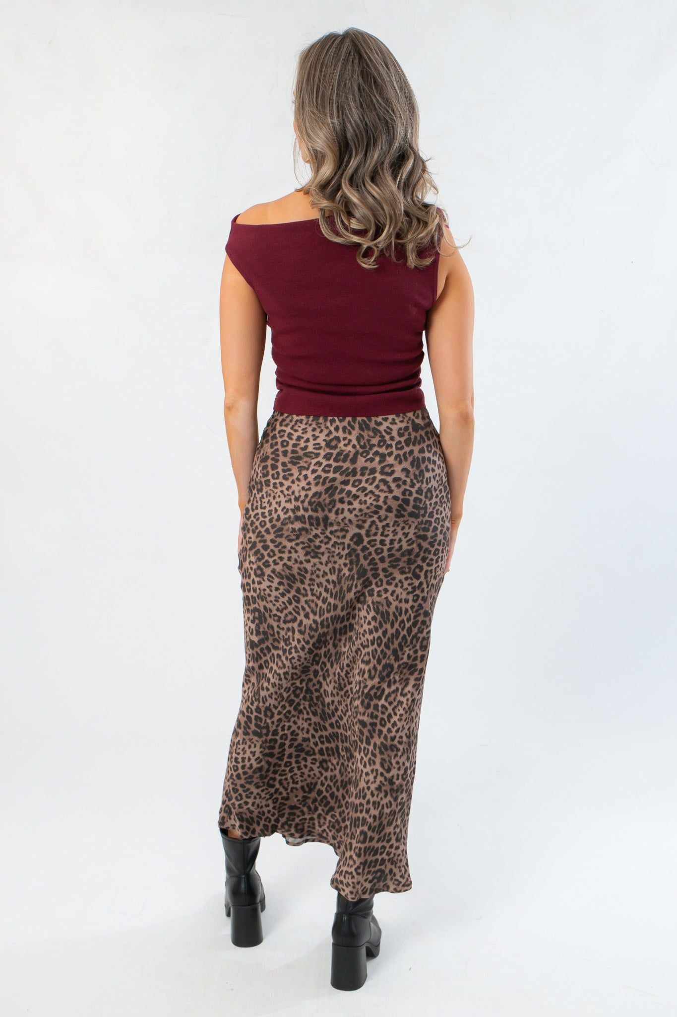 Back view of Z Supply Desert Tan Izabel Leopard Skirt showing smooth stretch satin fabric and elegant animal print pattern for fall fashion.
