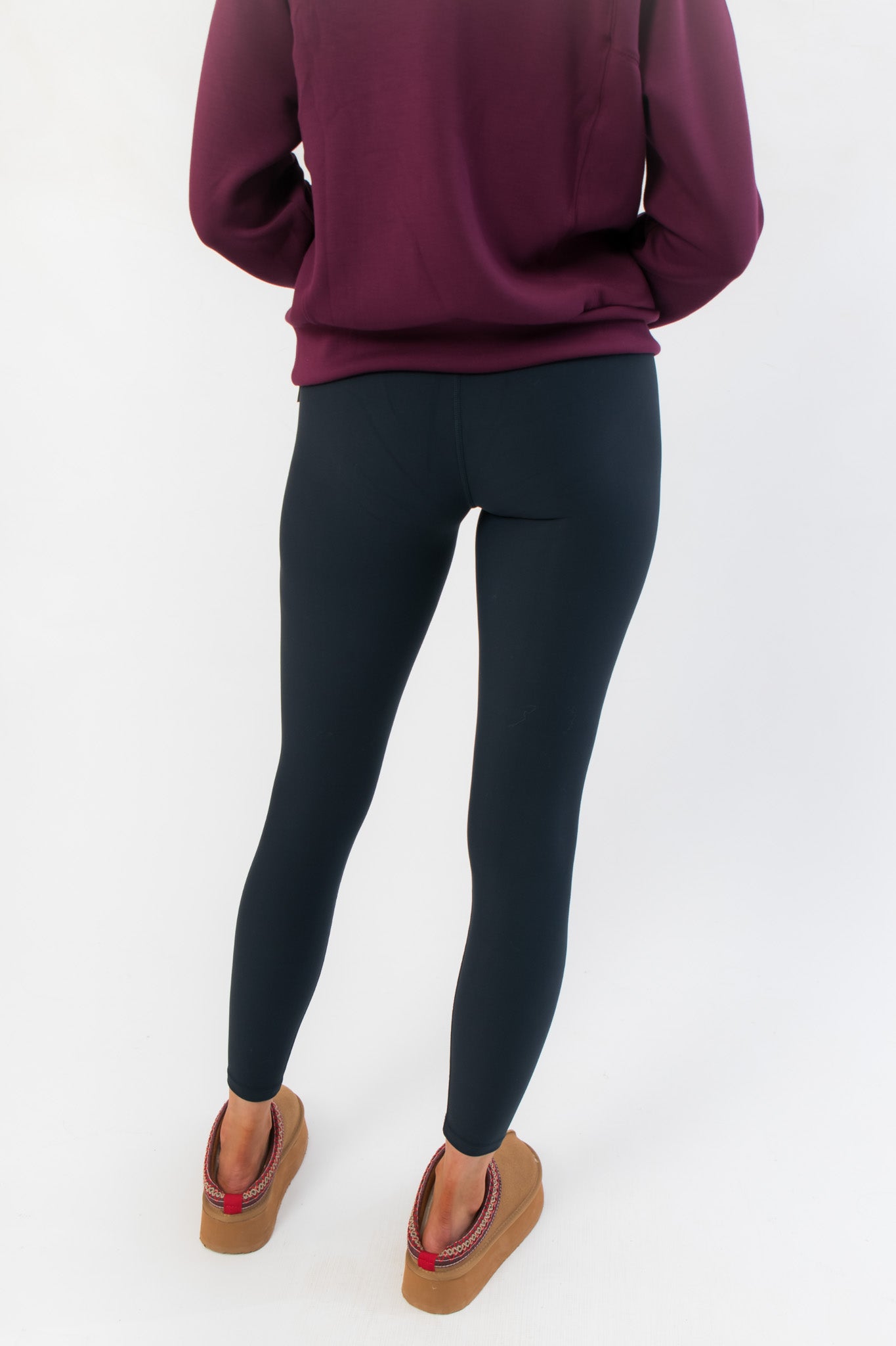 Detailed rear close-up of Spanx Very Black Full Length Leggings emphasizing body-hugging fit and seamless finish for a sleek look.