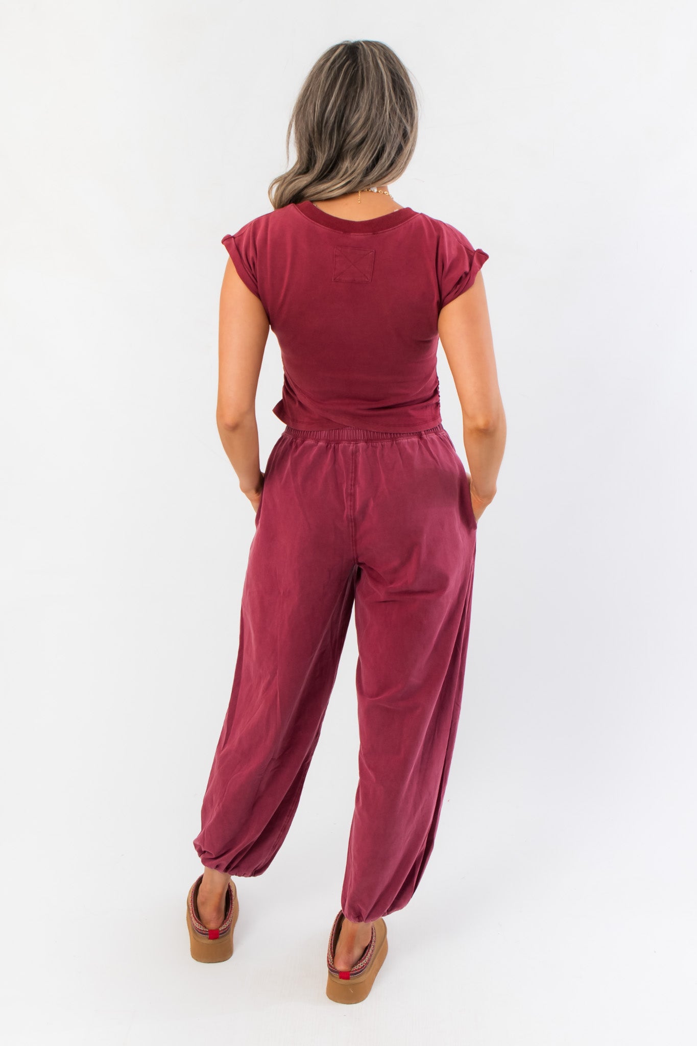 Back view of Winterberry Short Sleeve Crop Top and joggers set in berry red, highlighting the relaxed fit and casual lounge style.
