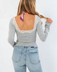 Back view of Free People Heather Grey Oh My Darling Long Sleeve top with deep lace-trimmed scoop back, perfect for stylish layering and comfort.