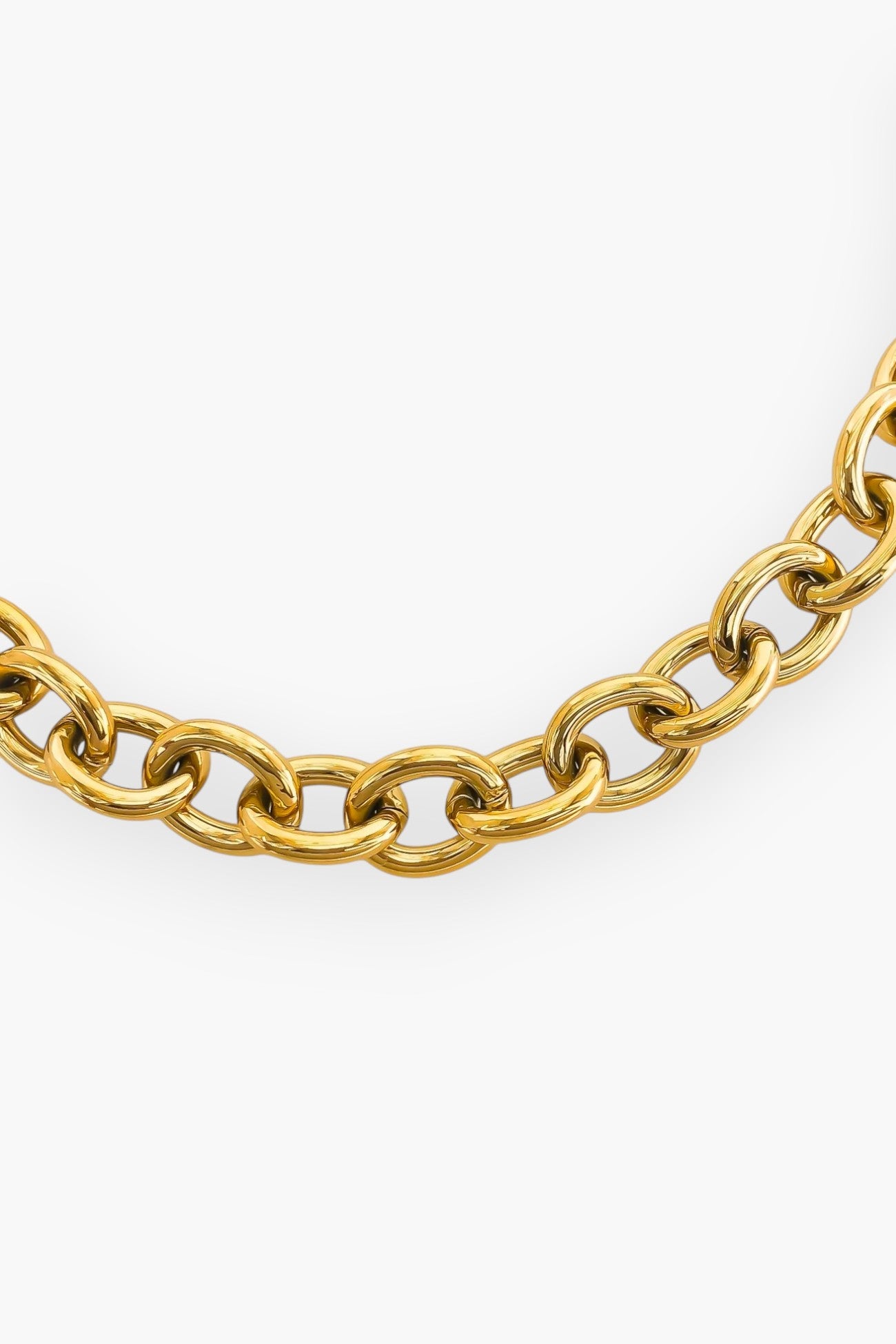 Close-up of the Ellie Gold Chunky Curb Chain Necklace, highlighting its durable triple-plated gold finish and bold interlocking links.