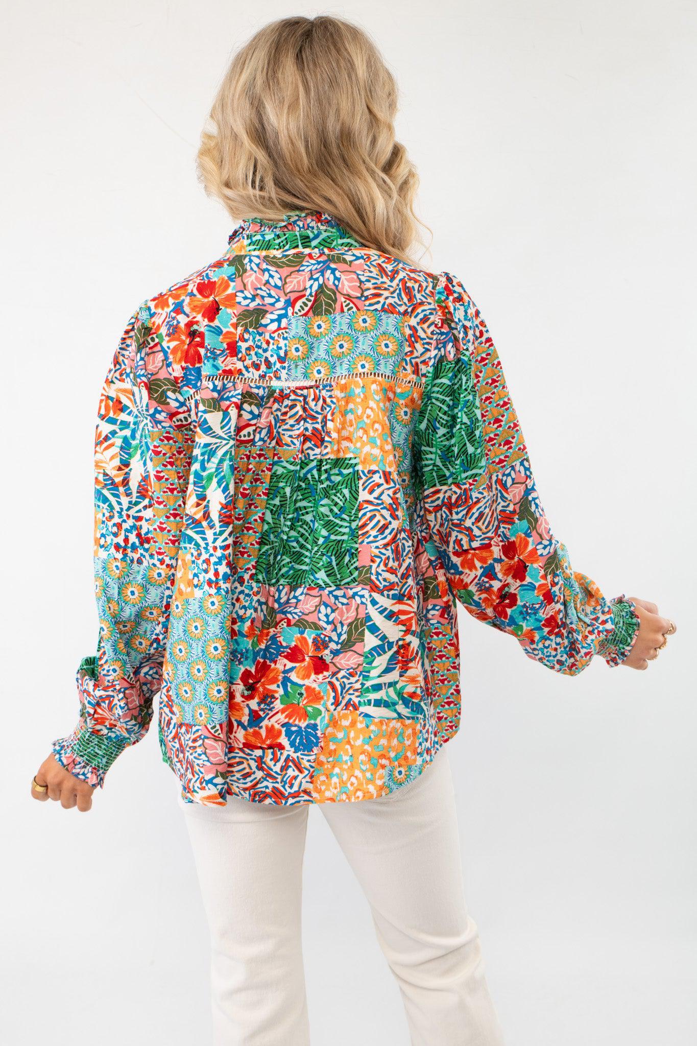 Back view of FA Ivory Multi Patchwork Print Blouse LM showcasing its colorful patchwork design and loose fit. Ideal for casual and chic outfits.