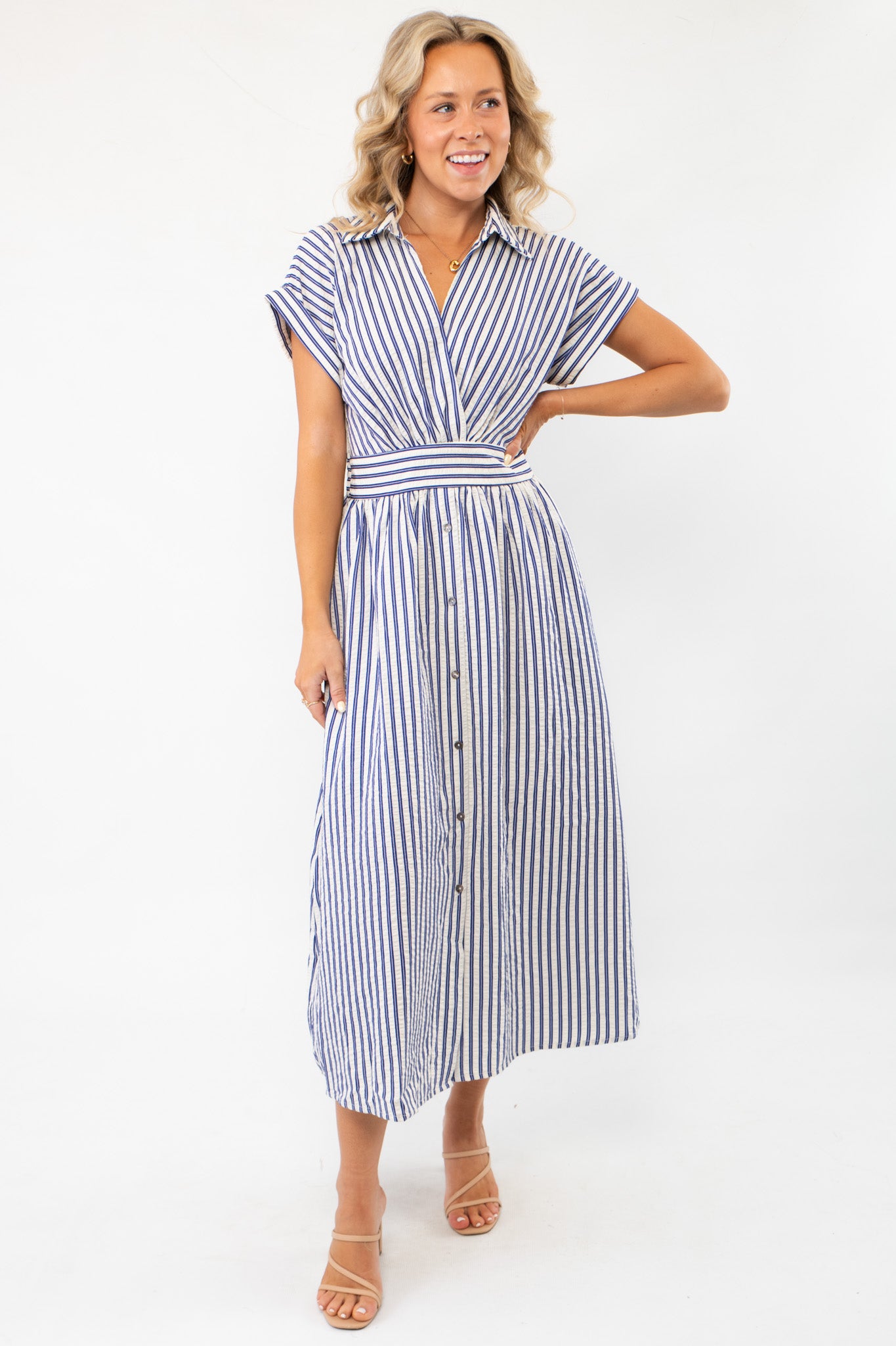 Model wearing the Favorite Things Blue Striped Midi Dress with a midi-length silhouette, short sleeves, and a stylish striped pattern for effortless elegance.