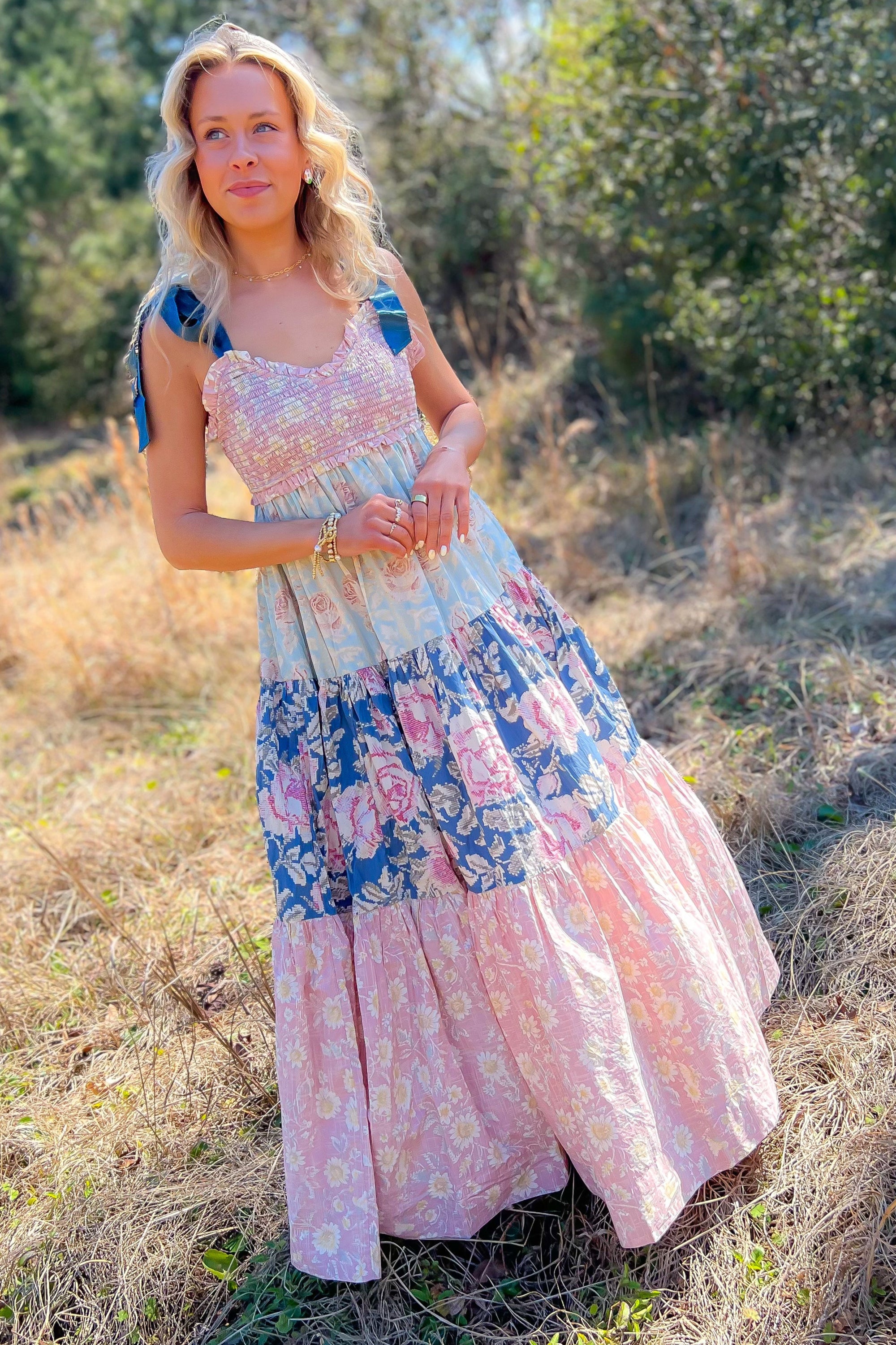 Effortless floral elegance in the Free People Antique Combo Bluebell Maxi Dress with ribbon-tied straps, a V-neckline, and flowing A-line silhouette.