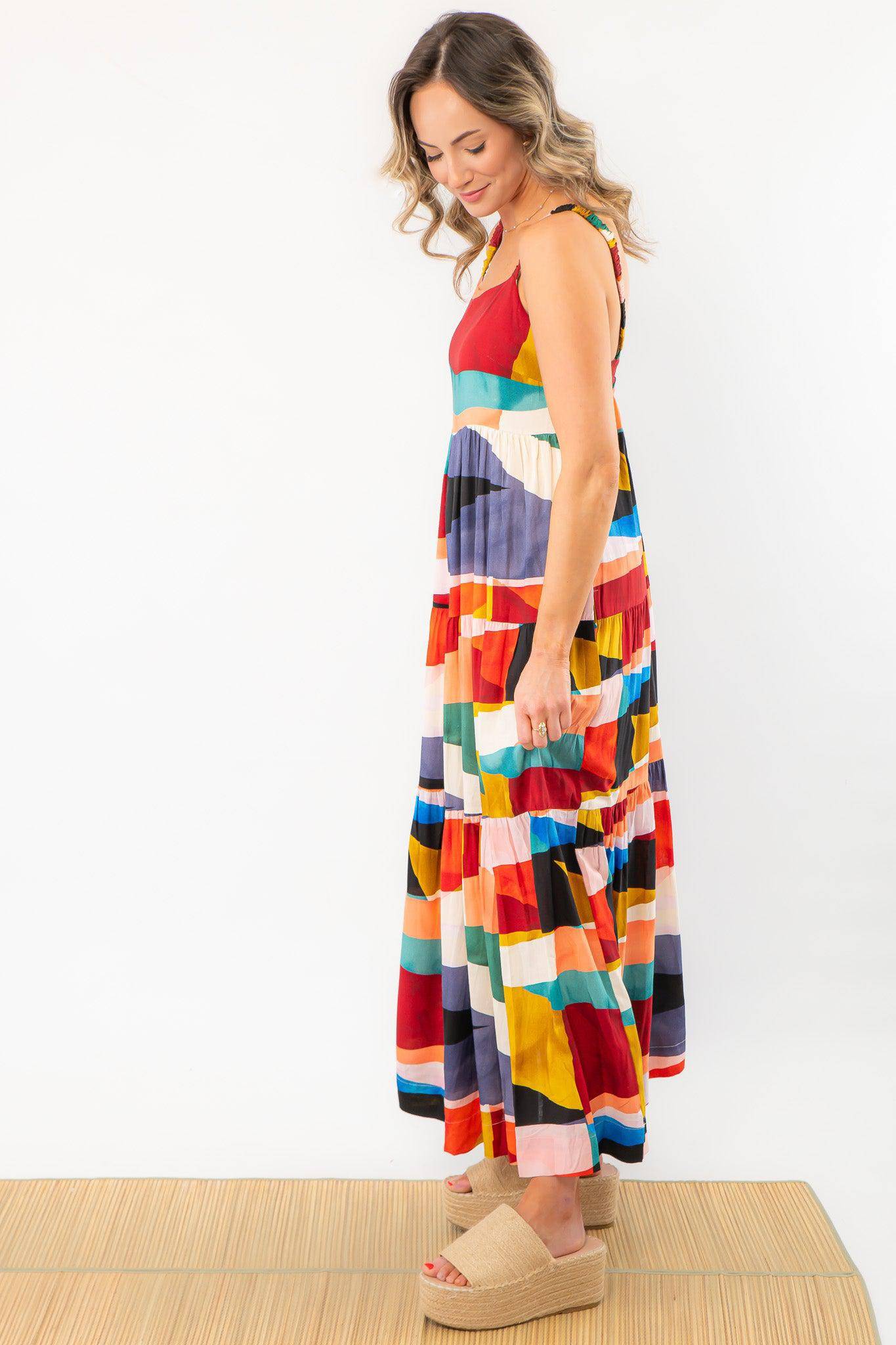 Side profile of a vibrant color block maxi dress with a relaxed fit. Perfect for vacations, beach outings, and casual summer wear.