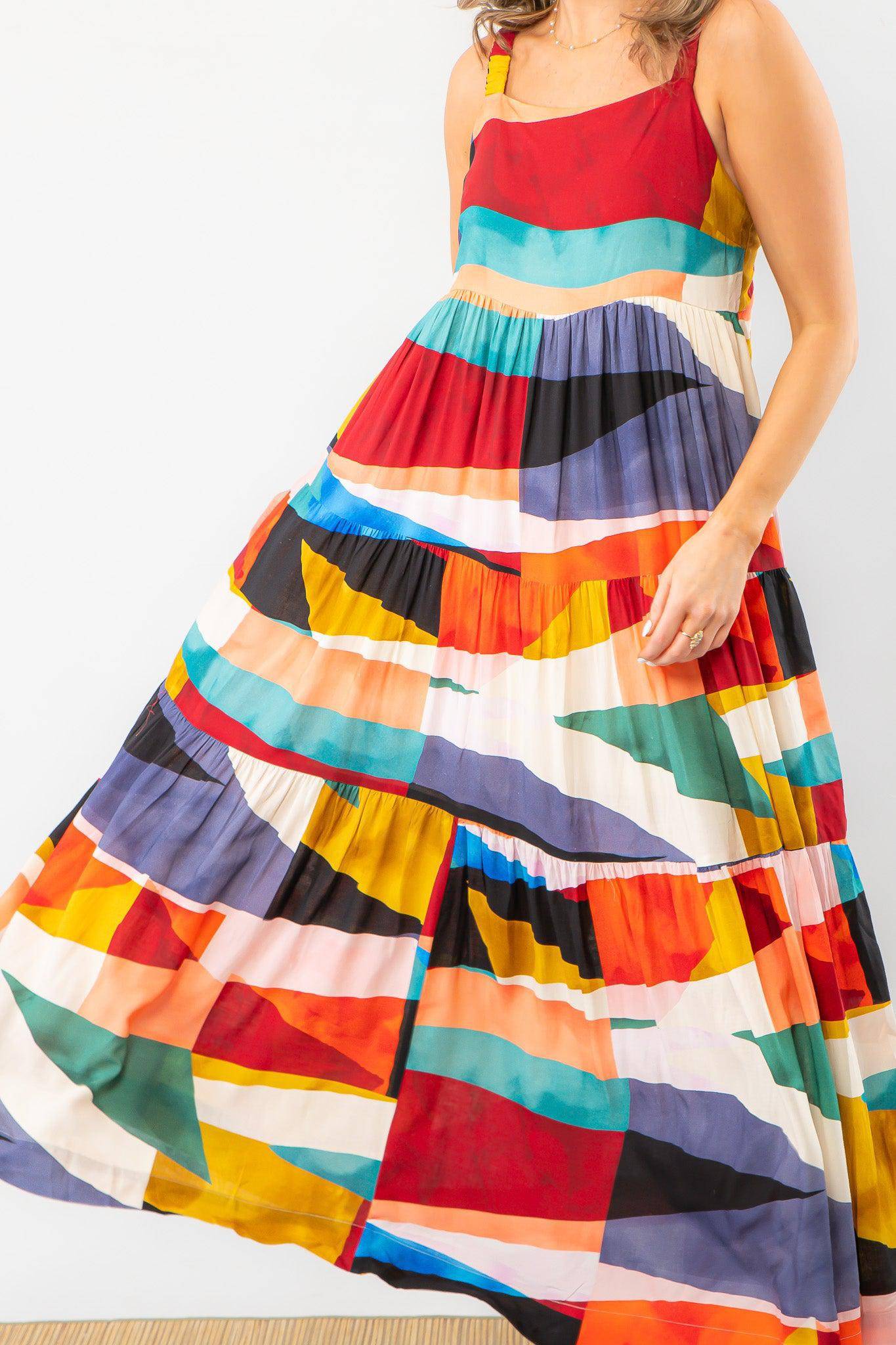 Close-up of a playful color block maxi dress with tiered detailing. A stylish and breezy choice for vacations and casual occasions.
