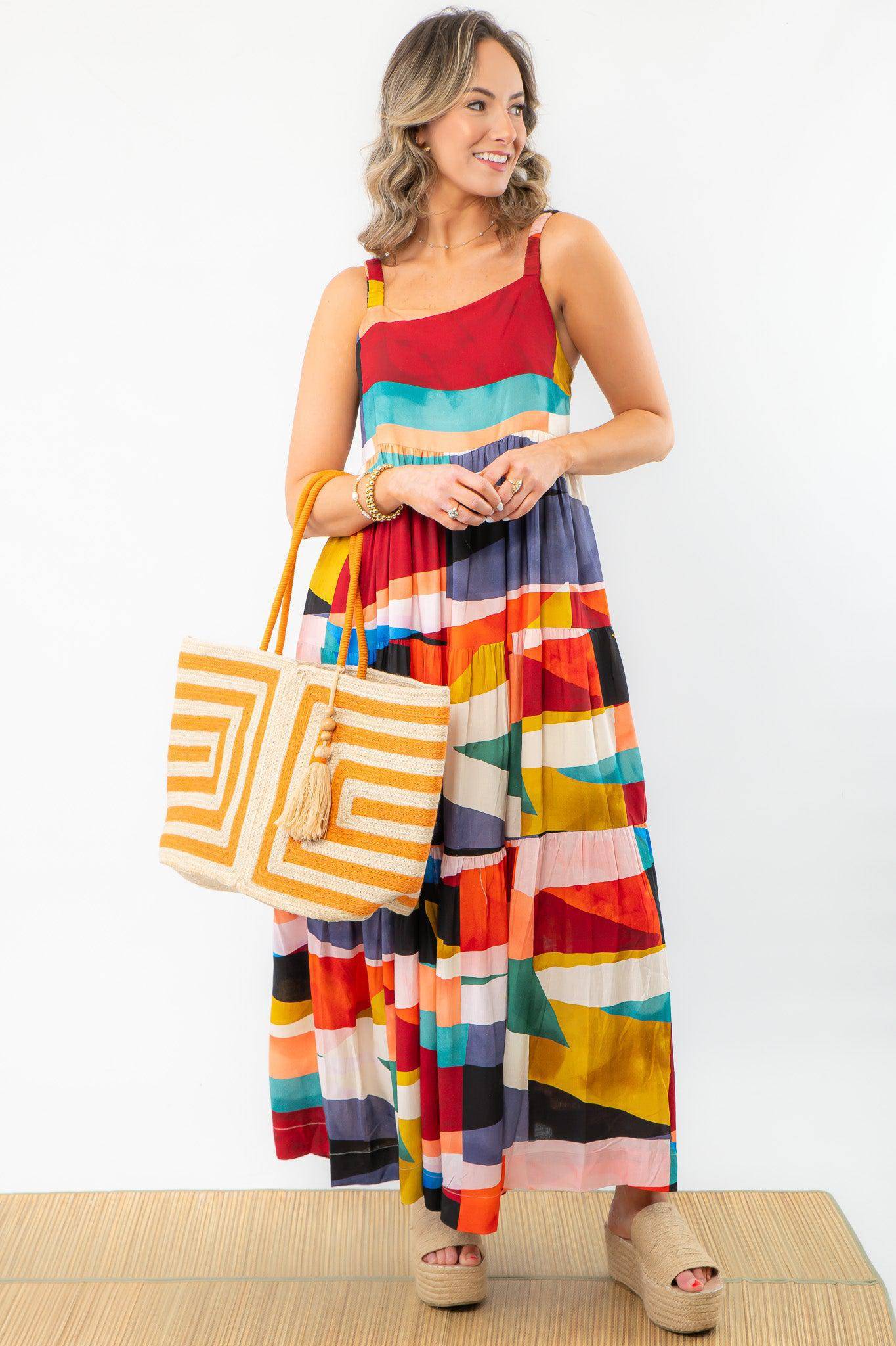 Color block maxi dress for a girls' trip, featuring vibrant hues, a breezy fit, and hidden pockets. Perfect for vacations and casual outings.