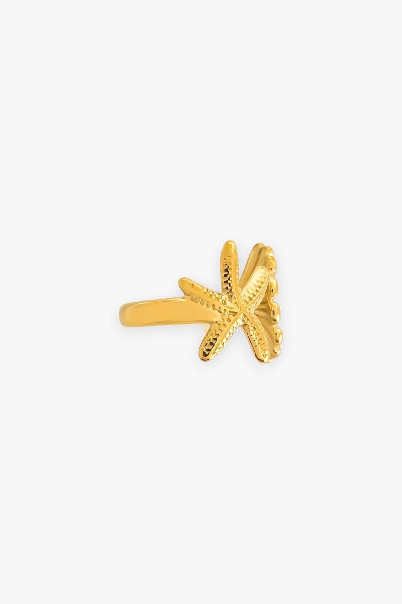 Side view of gold-plated seashell and starfish ring showcasing intricate detailing. Adjustable and water-resistant, perfect for coastal-inspired jewelry lovers.