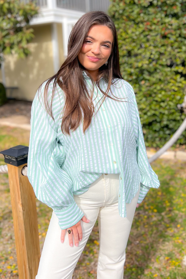 Sage green striped button-down shirt with a relaxed fit and stylish balloon sleeves, perfect for casual wear or as a breezy swim cover-up.