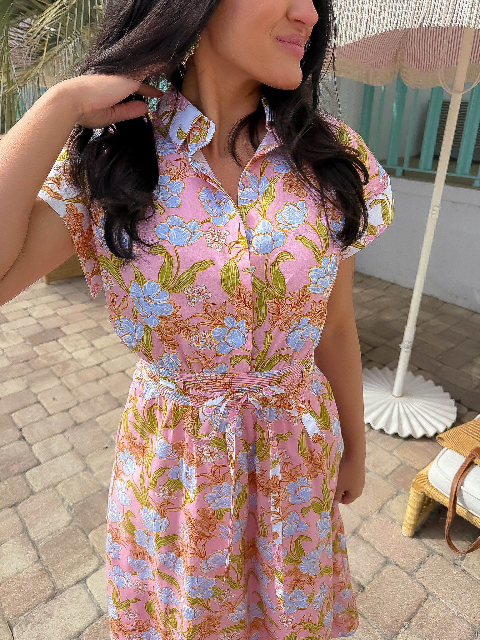 Close-up of Coral Gables Floral Midi Shirt Dress showing collared neckline, button-front detail, and vibrant pink and blue floral pattern.
