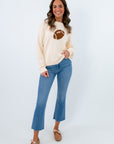 Lightweight cream sweater with football icon, sweater with football on it, football sweater for game day
