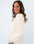Stylish football sweater for casual outings, lightweight cream sweater for fall, versatile game day sweater for fall