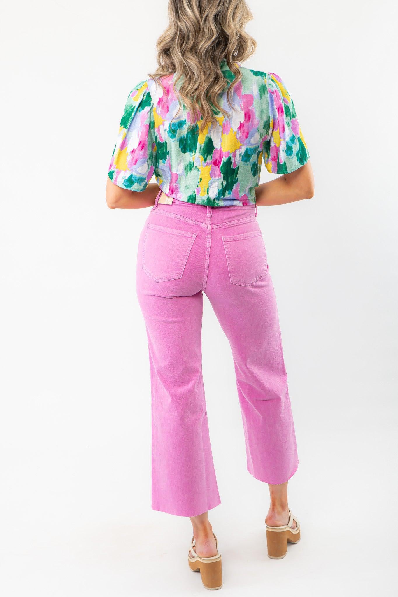 Back view of KUT Peony Pink Meg High Rise Wide Leg Jeans, showcasing flattering pocket placement and raw hem. Ideal for Easter parties and casual outings.