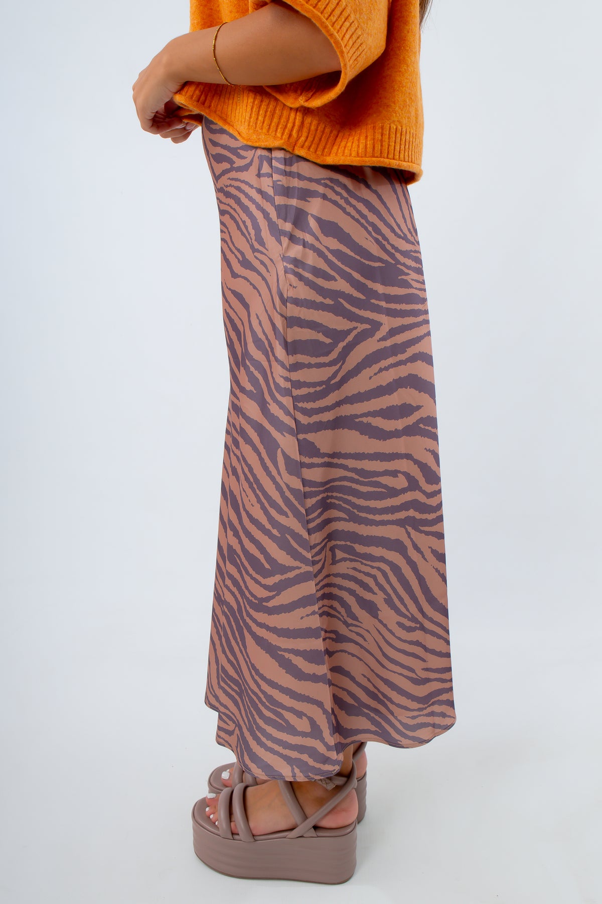 Elegant tiger print skirt with discreet zipper for game day style, purple and beige midi skirt for fall