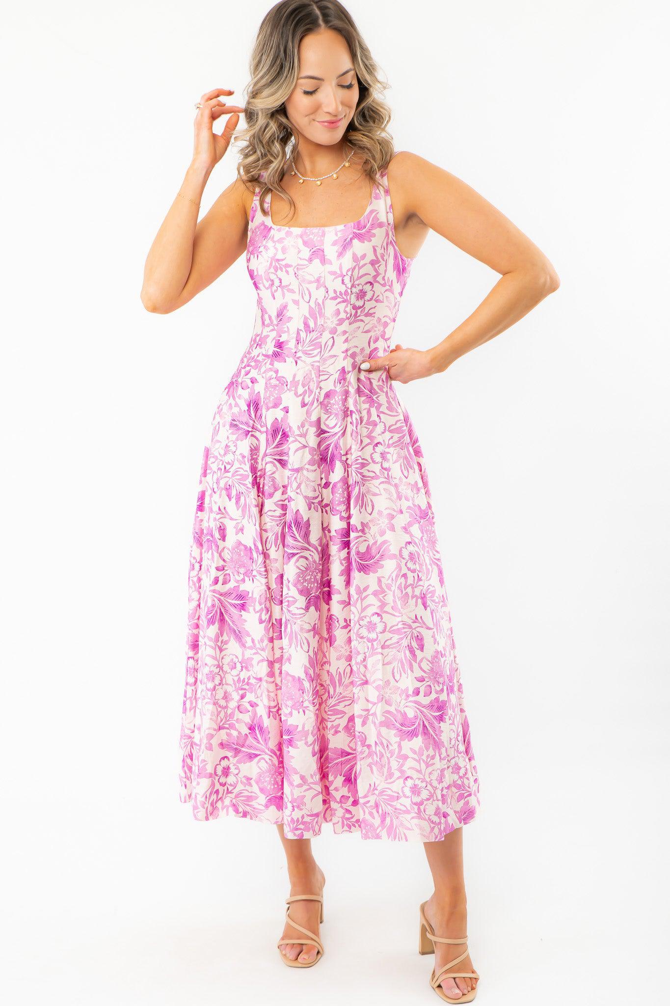 Layton Blush Tropical Print Midi Dress with a scoop neckline and sleeveless design. A perfect vacay must-have featuring a fitted bodice and flowy skirt.