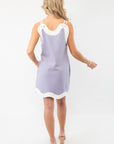 Back view of the Linen Blue Wave Mini Dress showcasing its double straps, wave hem, and relaxed fit for effortless summer elegance.