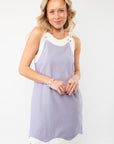 Close-up of the Linen Blue Wave Mini Dress highlighting its eyelet details, soft fabric, and flattering silhouette for a chic summer look.