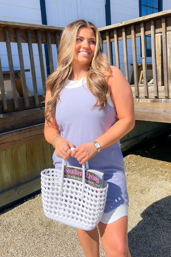 Linen Blue Wave Mini Dress with contrast wave hem and eyelet detailing, perfect for summer. Features double strap accents and a breezy fit.