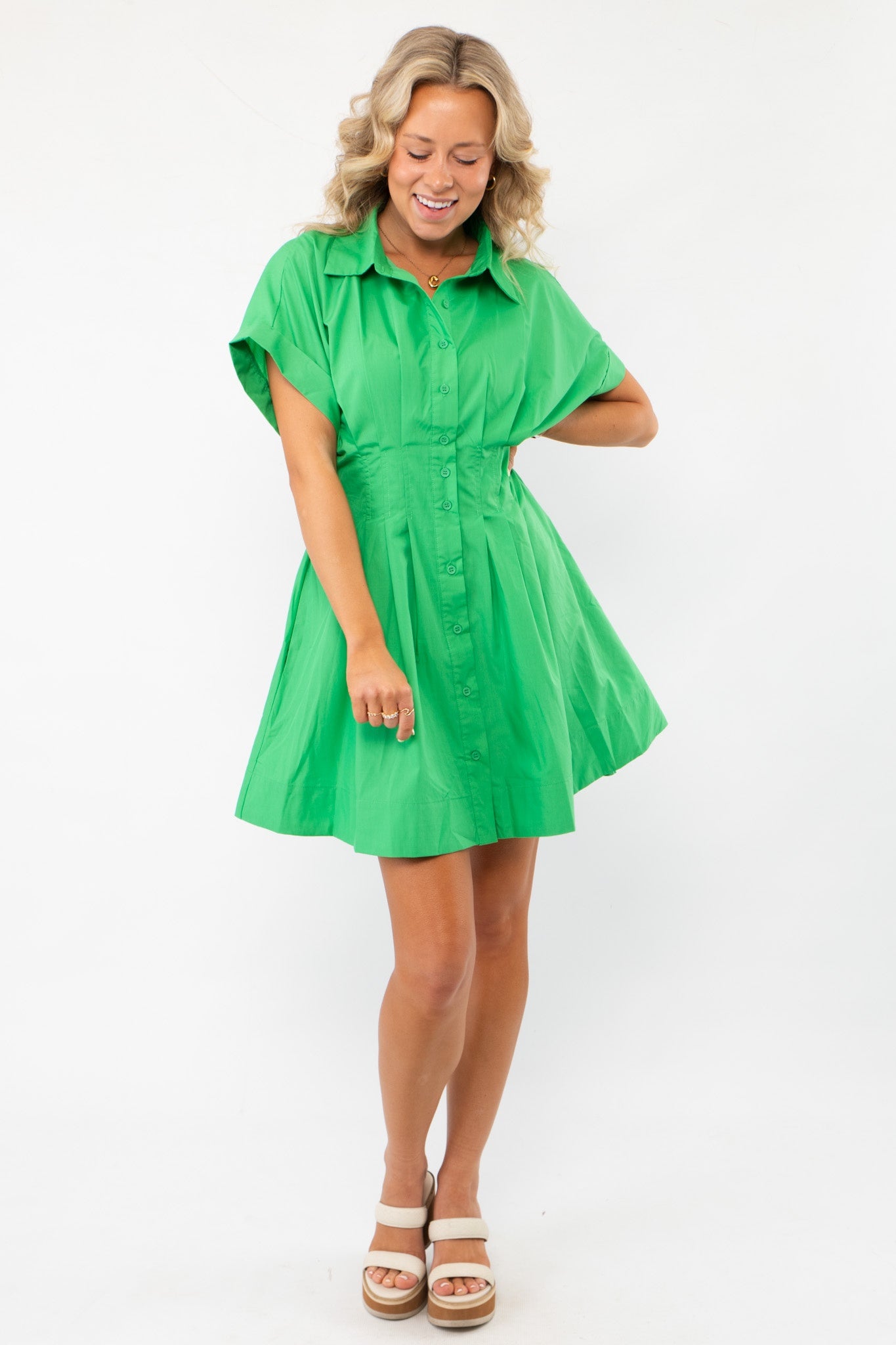 Lucky You Kelly Green Button Up Mini Dress featuring a collared neckline, short sleeves, and a flared silhouette for a chic and effortless look.