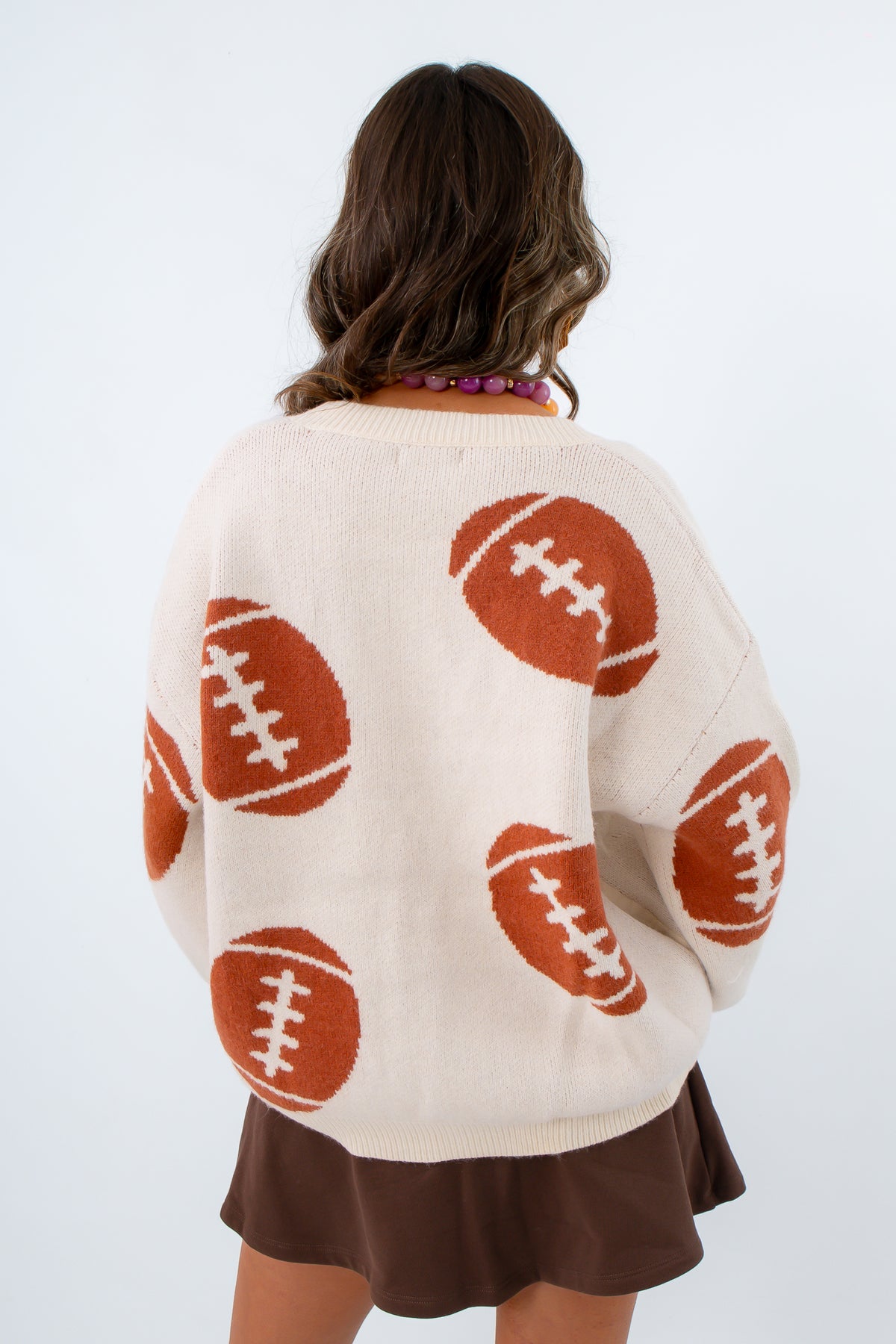 Ivory cardigan with oversized fit and functional buttons
