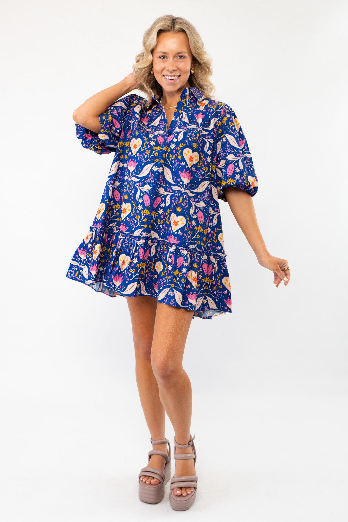 Model wearing the Morgan Folk Love Mini Dress with a flattering babydoll silhouette, collared neckline, and puff sleeves for a trendy outfit.