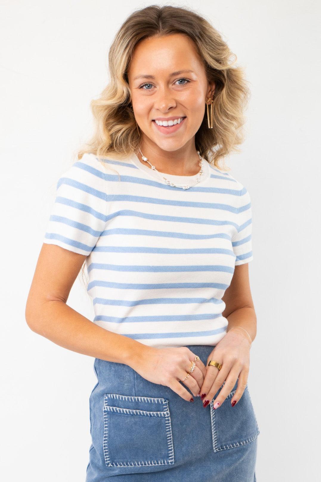 Next Up Blue Striped Knit Crop Top with short sleeves and a crew neckline, paired with a denim skirt for a chic summer look.