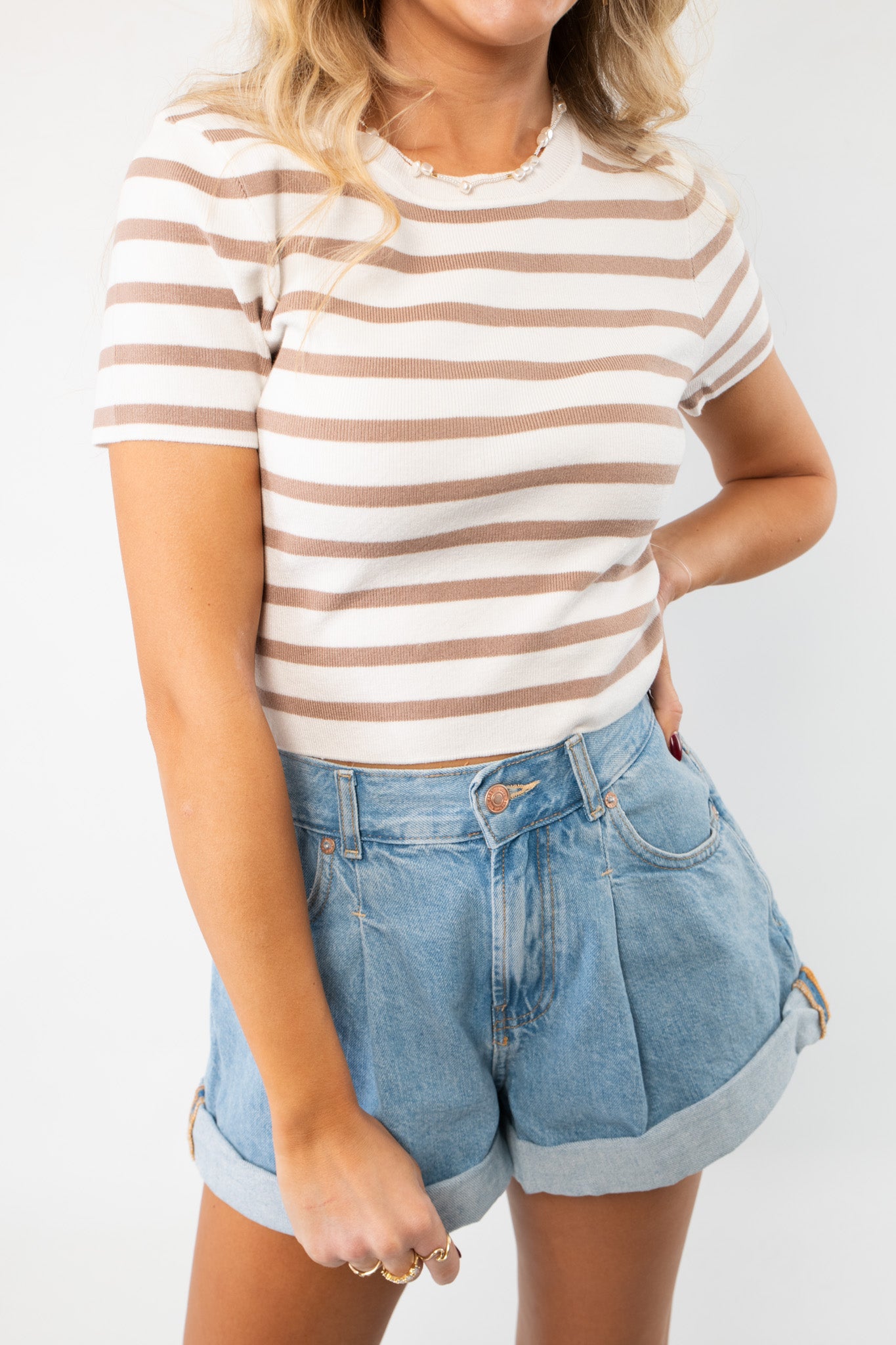 Close-up of the Next Up Taupe Striped Knit Crop Top, showcasing its ribbed knit texture, taupe and white stripes, and flattering cropped fit.