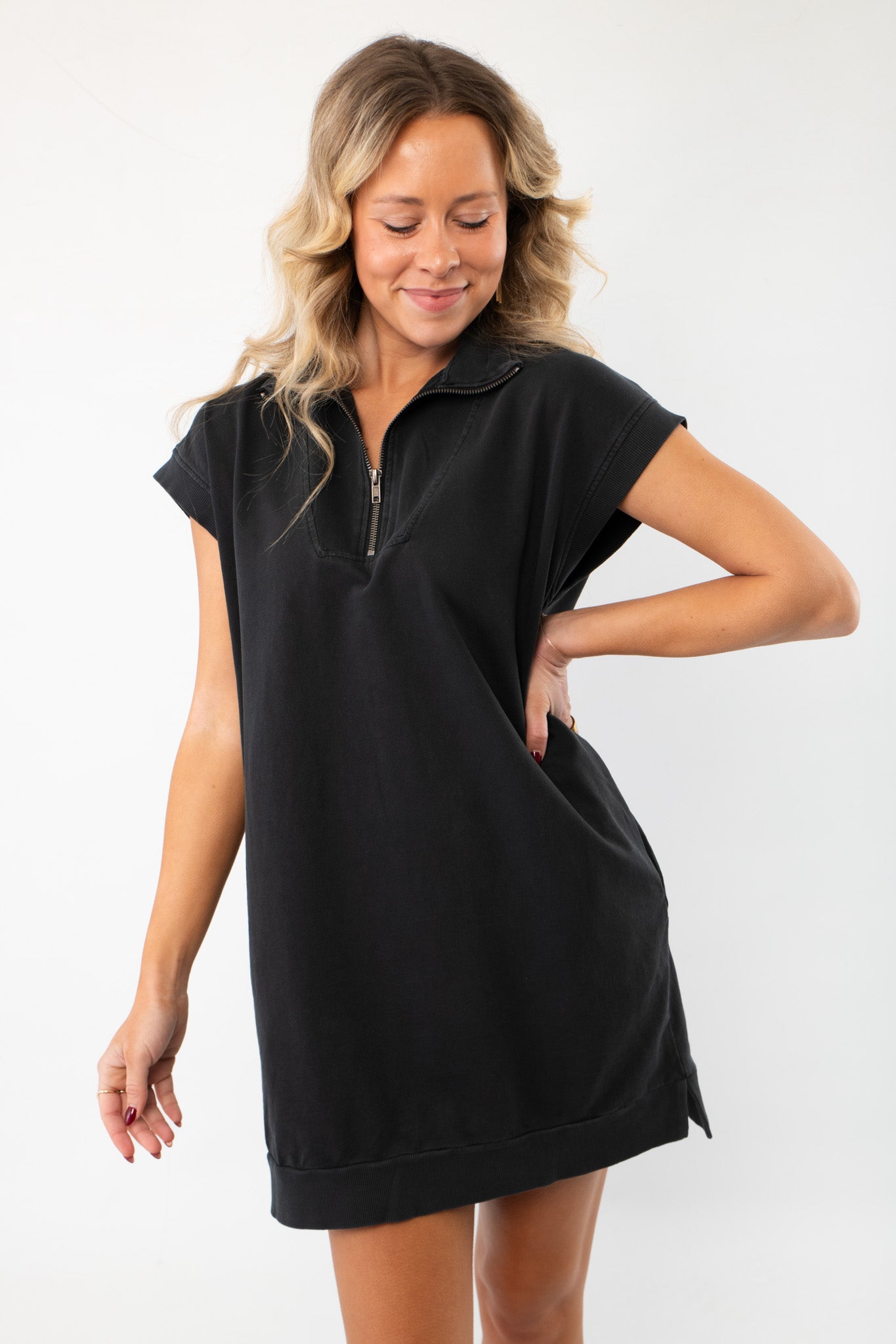 On The Go Black Quarterzip Mini Dress with a relaxed fit, featuring a collared neckline and short sleeves. Perfect for casual outings and everyday wear.