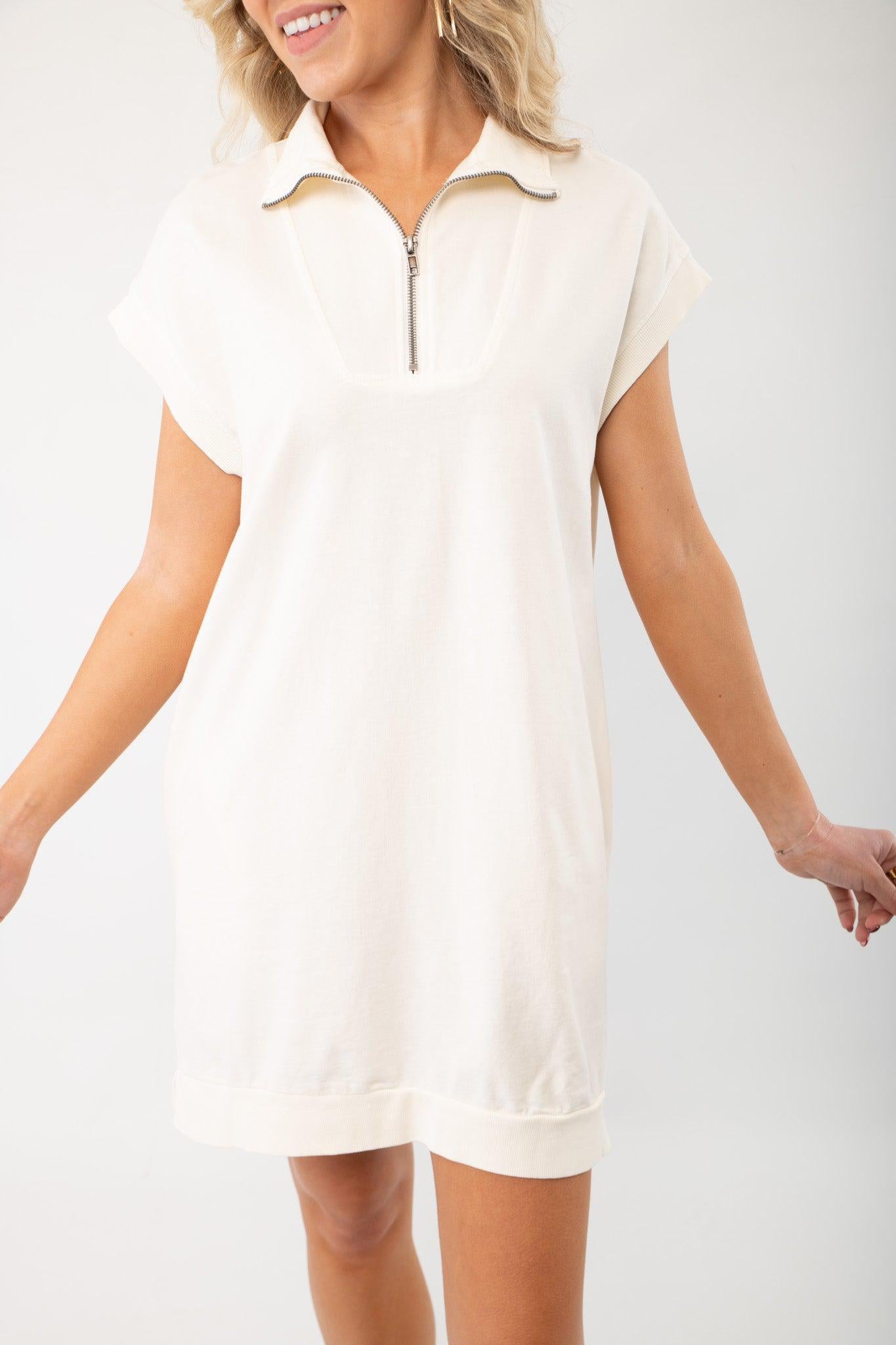 On the Go Cream Quarterzip Mini Dress featuring a relaxed fit, short sleeves, and a stylish quarter-zip neckline for effortless casual wear.