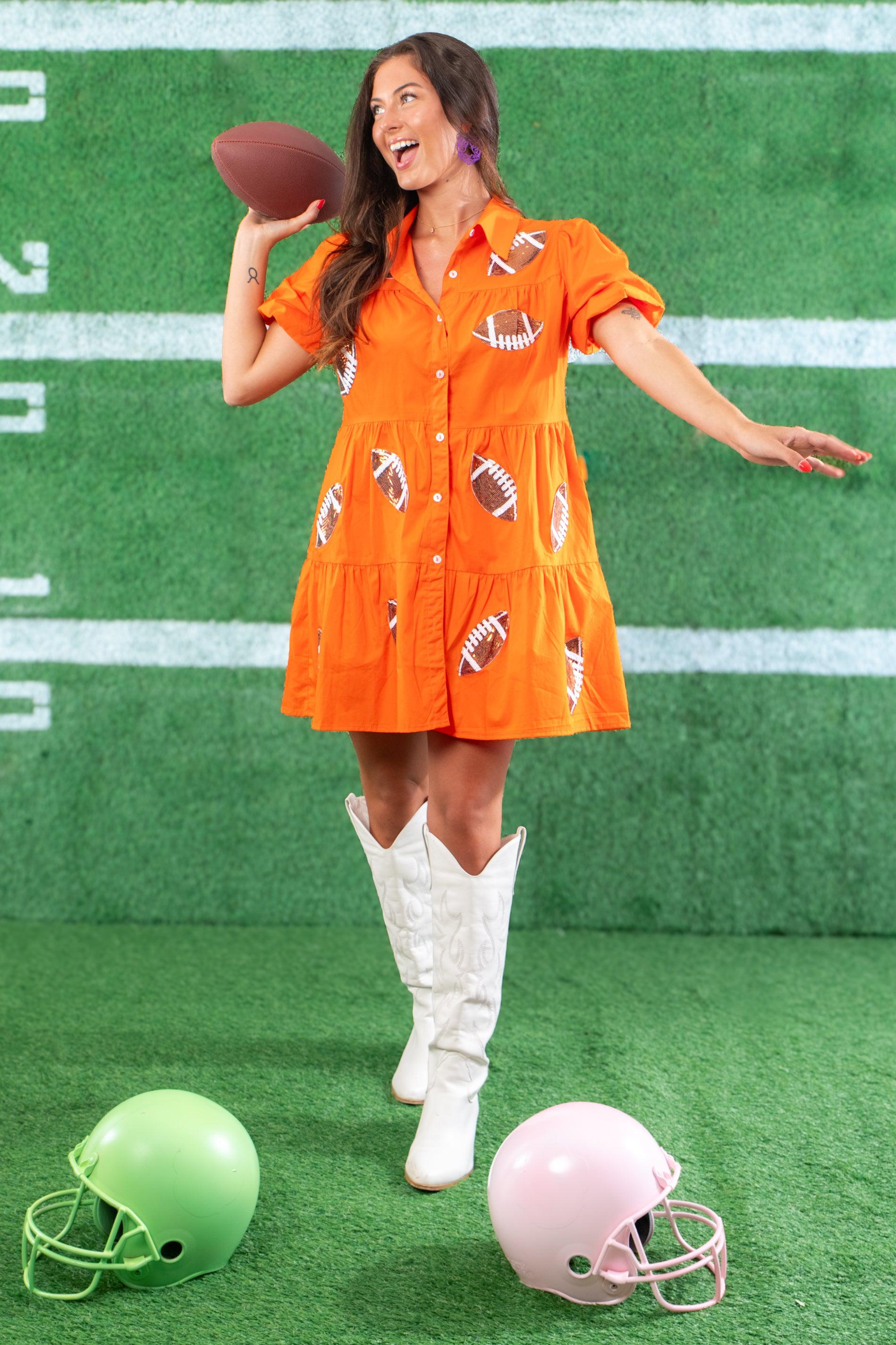 Show off your team spirit in the Orange Sequin Football Dress, a vibrant short dress with football-themed sequins and a tiered silhouette.