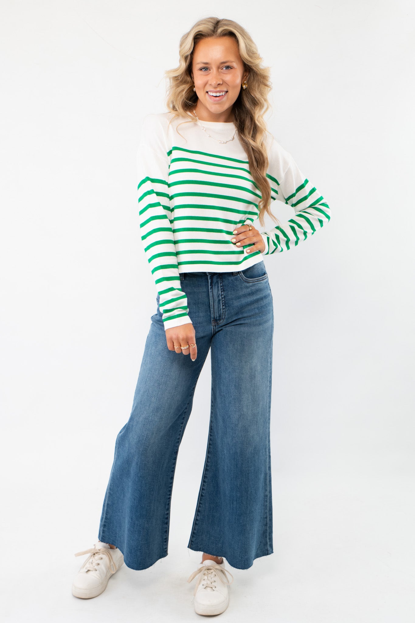 Pinch Me Green Striped Long Sleeve Top featuring a relaxed fit, crew neckline, and vibrant green stripes, paired with denim jeans for a casual look.