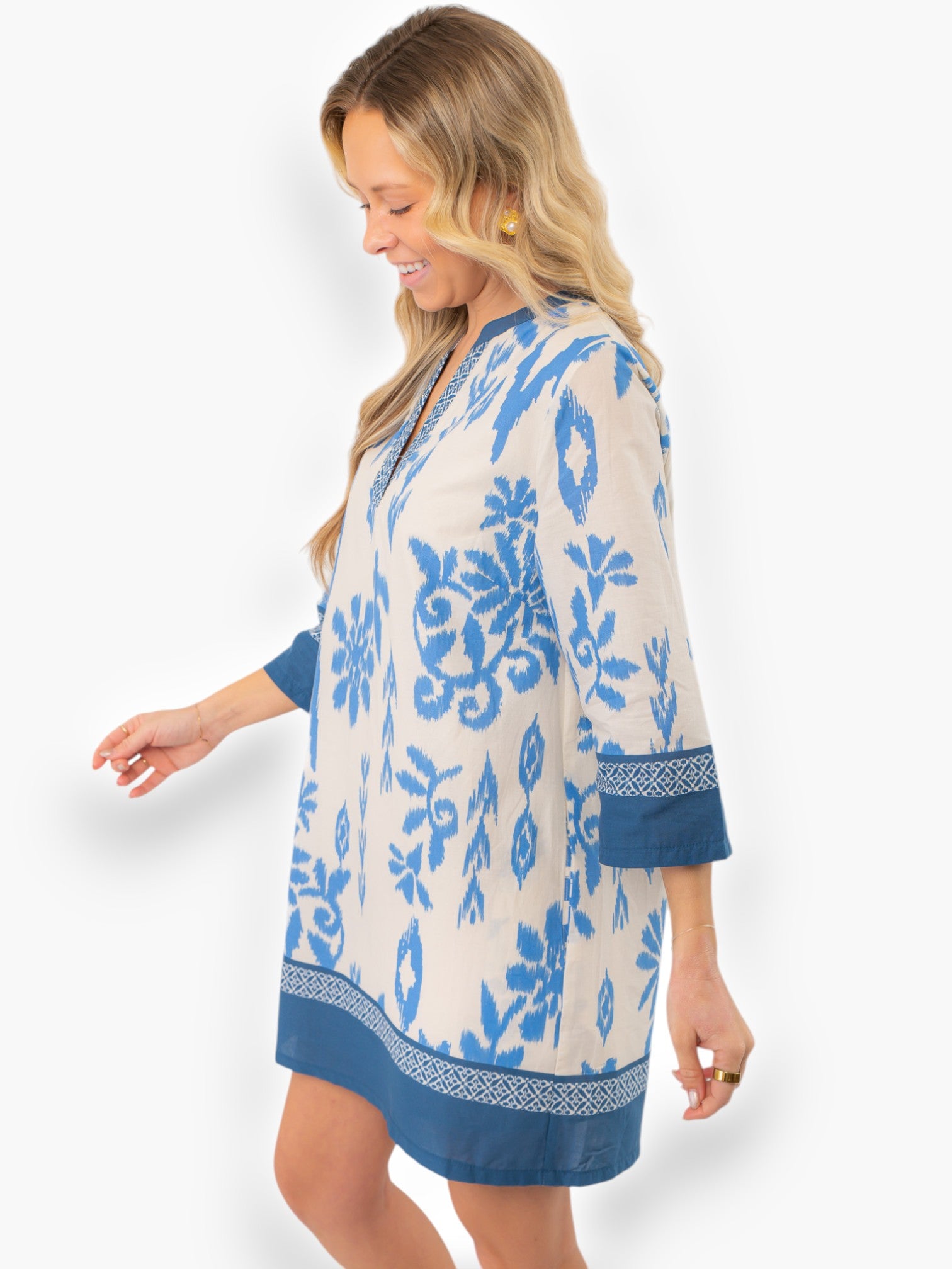 Side profile of the Priscilla Blue Print Kaftan Dress highlighting its intricate blue patterns and comfortable three-quarter sleeves.