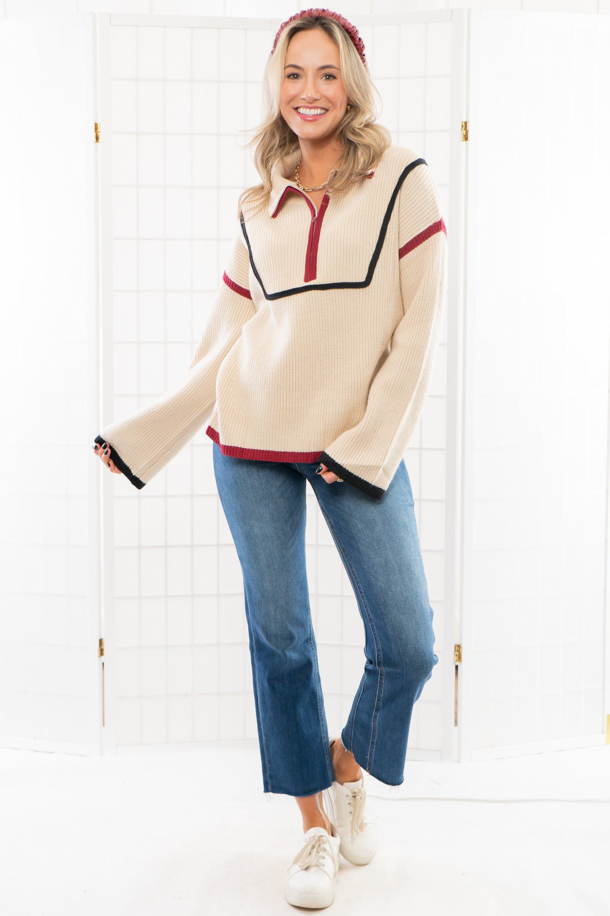 Model wearing a garnet and black Quarter Zip Sweater with contrast piping. A cozy knit sweater ideal for casual outings and cool weather.