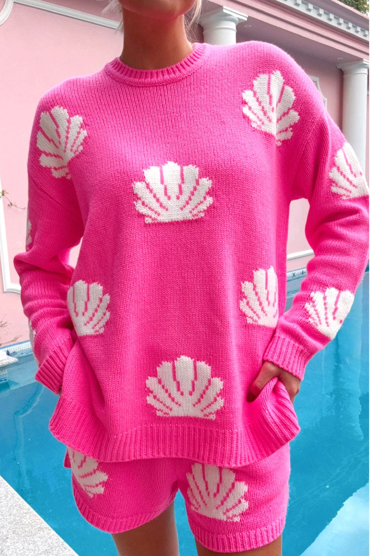 Show Me Your Mumu Hot Pink Shell Go To Sweater featuring a cozy crewneck design with white shell knit patterns. Perfect for layering on vacation or casual outings.