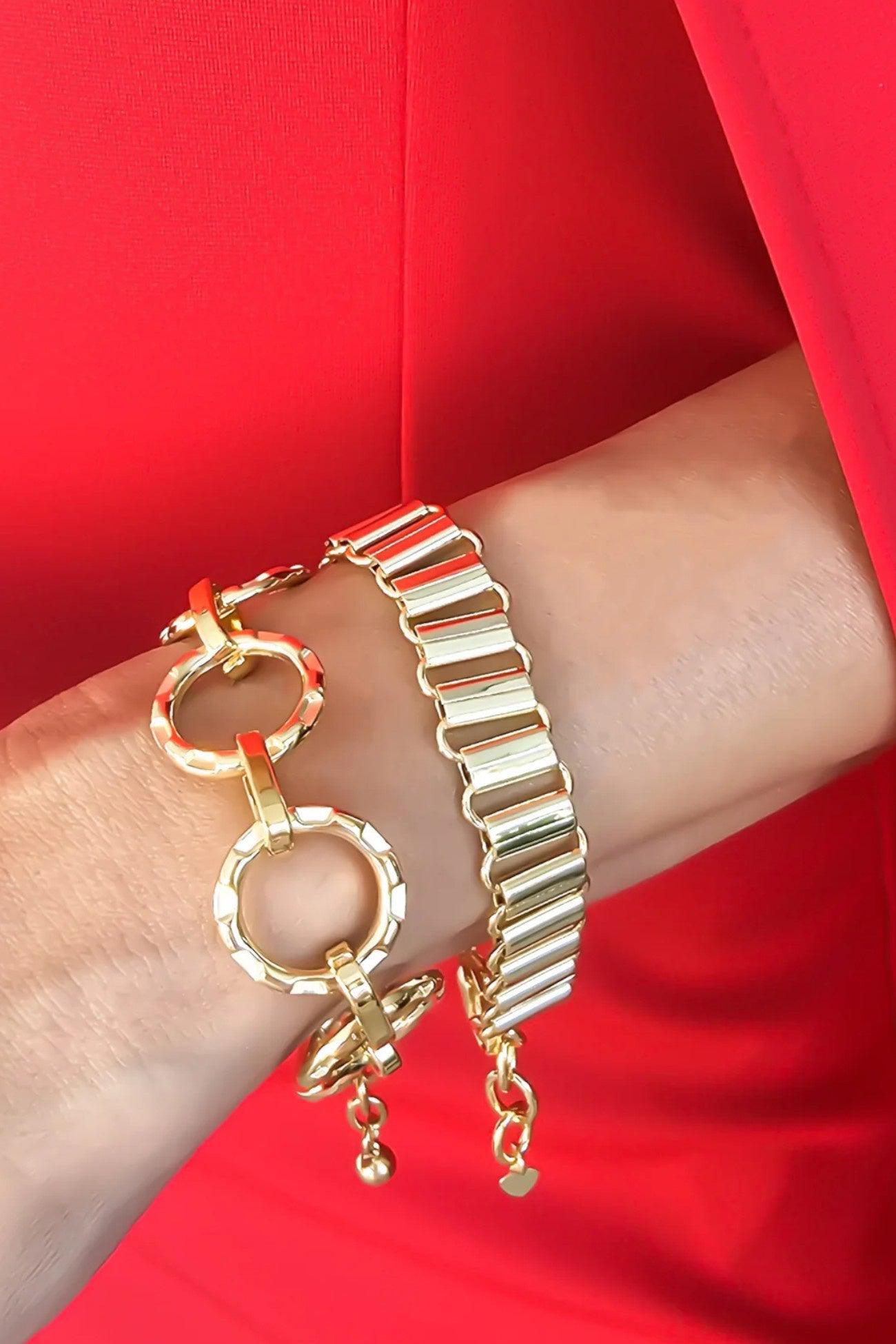 Elegant Soho Gold O-Chain Chunky Bracelet worn on wrist, paired with another gold bracelet. Stylish and water-resistant, perfect for any occasion.