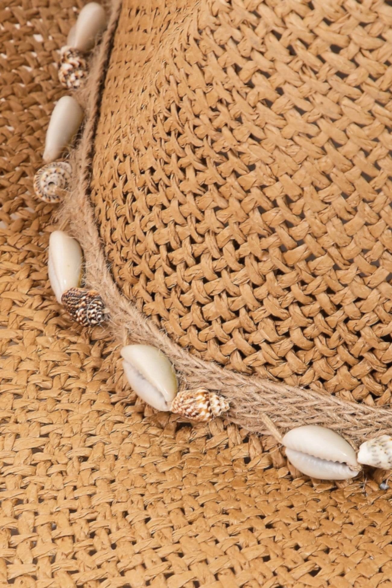 Close-up of the Coastal Vibes Puka Shell Straw Cowboy Hat showcasing intricate woven straw details and decorative puka shell accents.