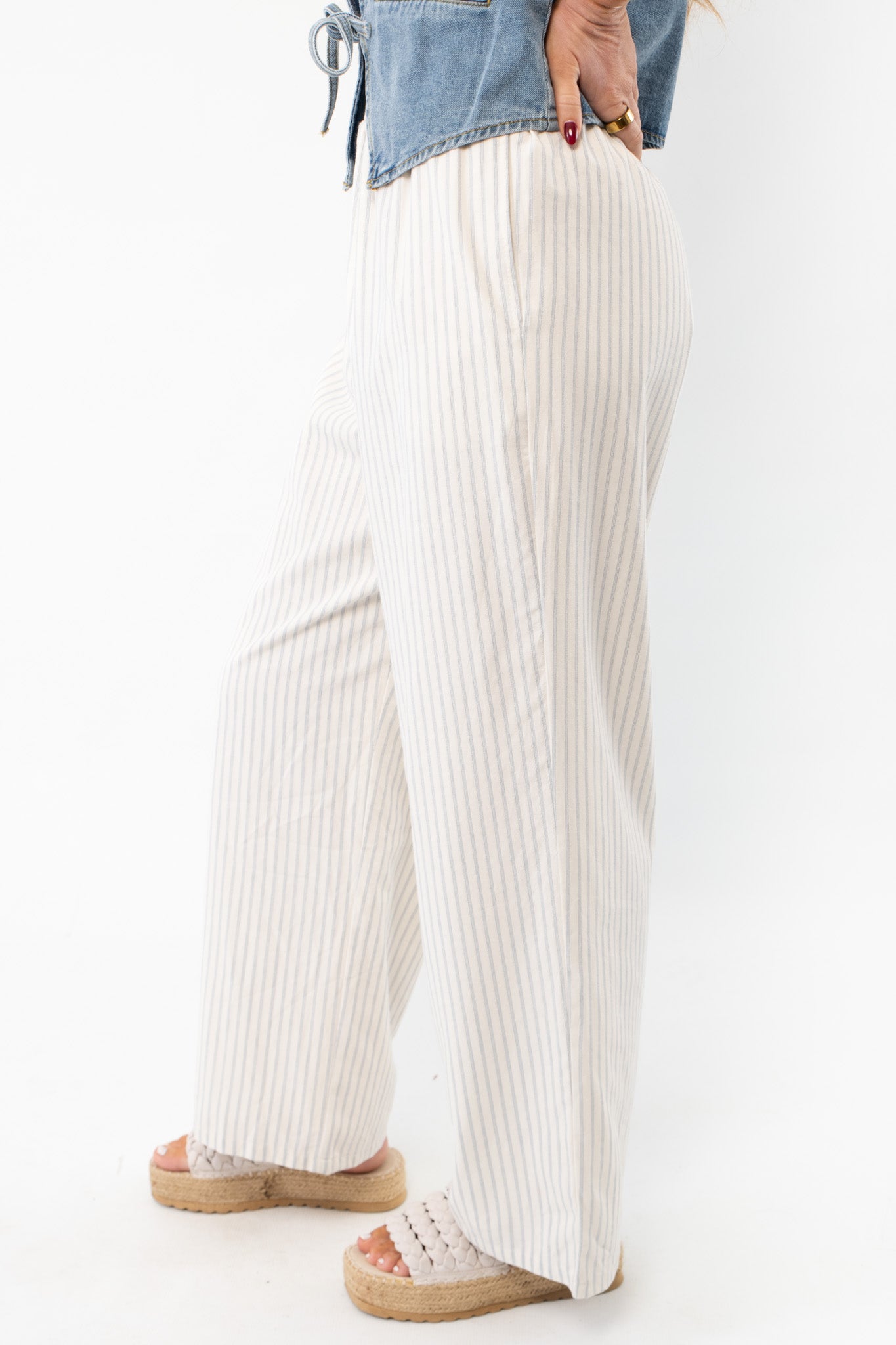 Side view of Sullivan Striped Boxer Linen Pants showcasing a relaxed wide-leg fit and breathable linen fabric, ideal for warm-weather styling.