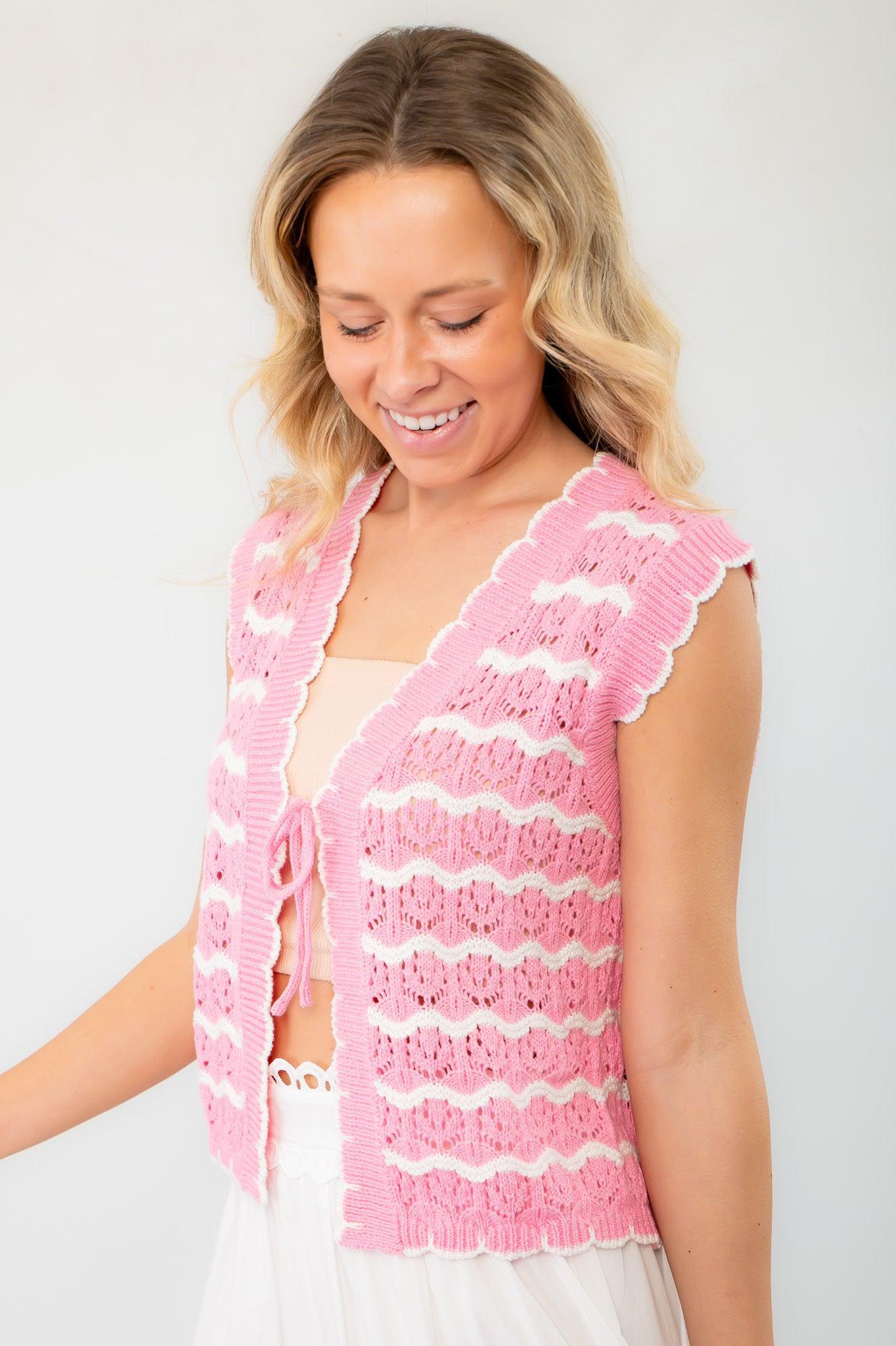 Close-up of the Sweet As Can Be Pink Crochet Open Front Tie Vest, showcasing intricate crochet patterns and a flattering tie-front closure.