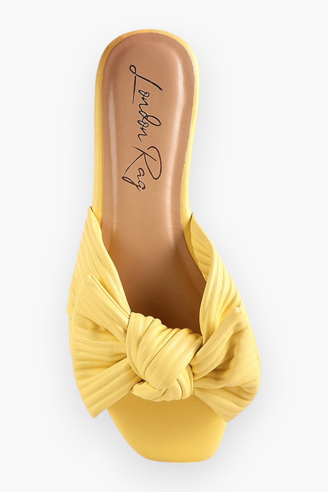 Top view of yellow textured bow slide flats from L. Mae Boutique, highlighting the elegant knotted bow and sleek slip-on design.