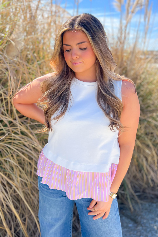 The Fun Of It White & Pink Tank Top featuring a playful pink and yellow striped layered hem, perfect for a stylish summer look.