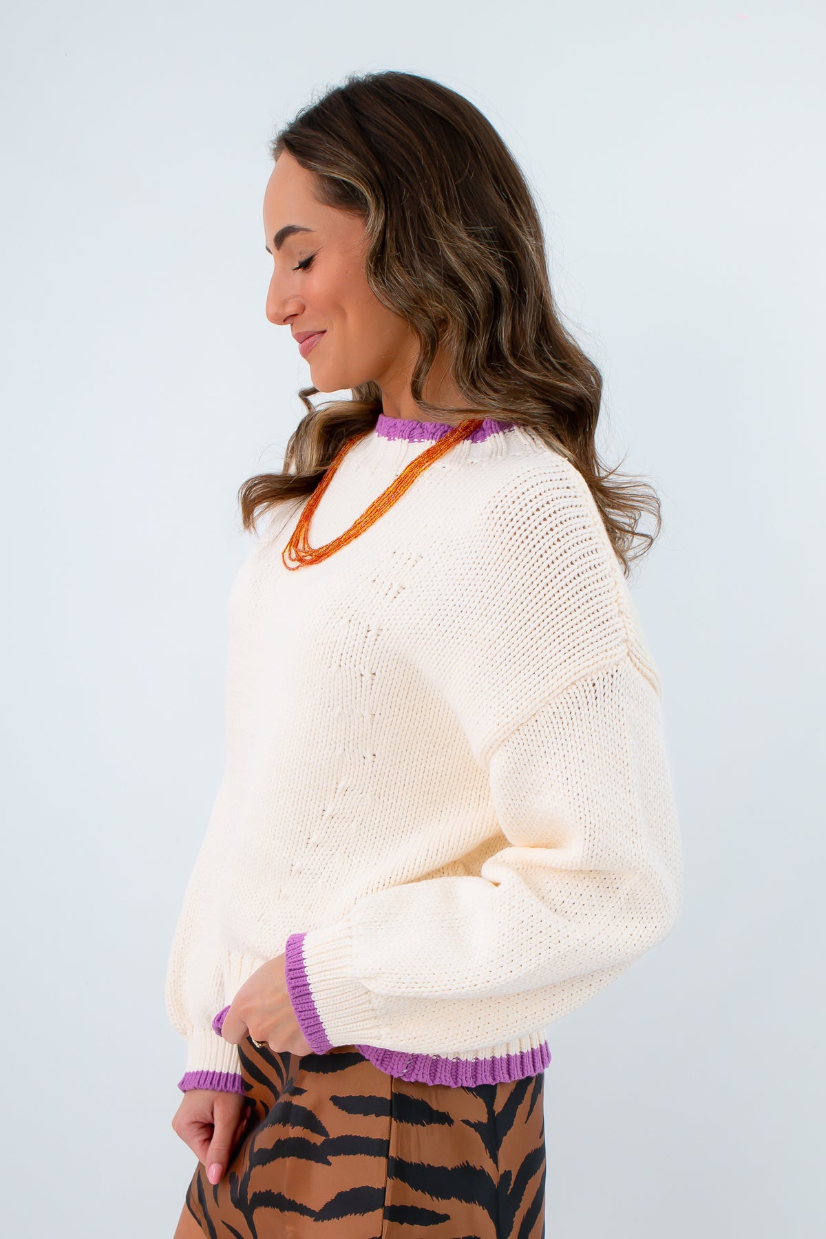 feminine hip-length knit sweater blending comfort with bold details, versatile purple-trimmed sweater for clemson game day