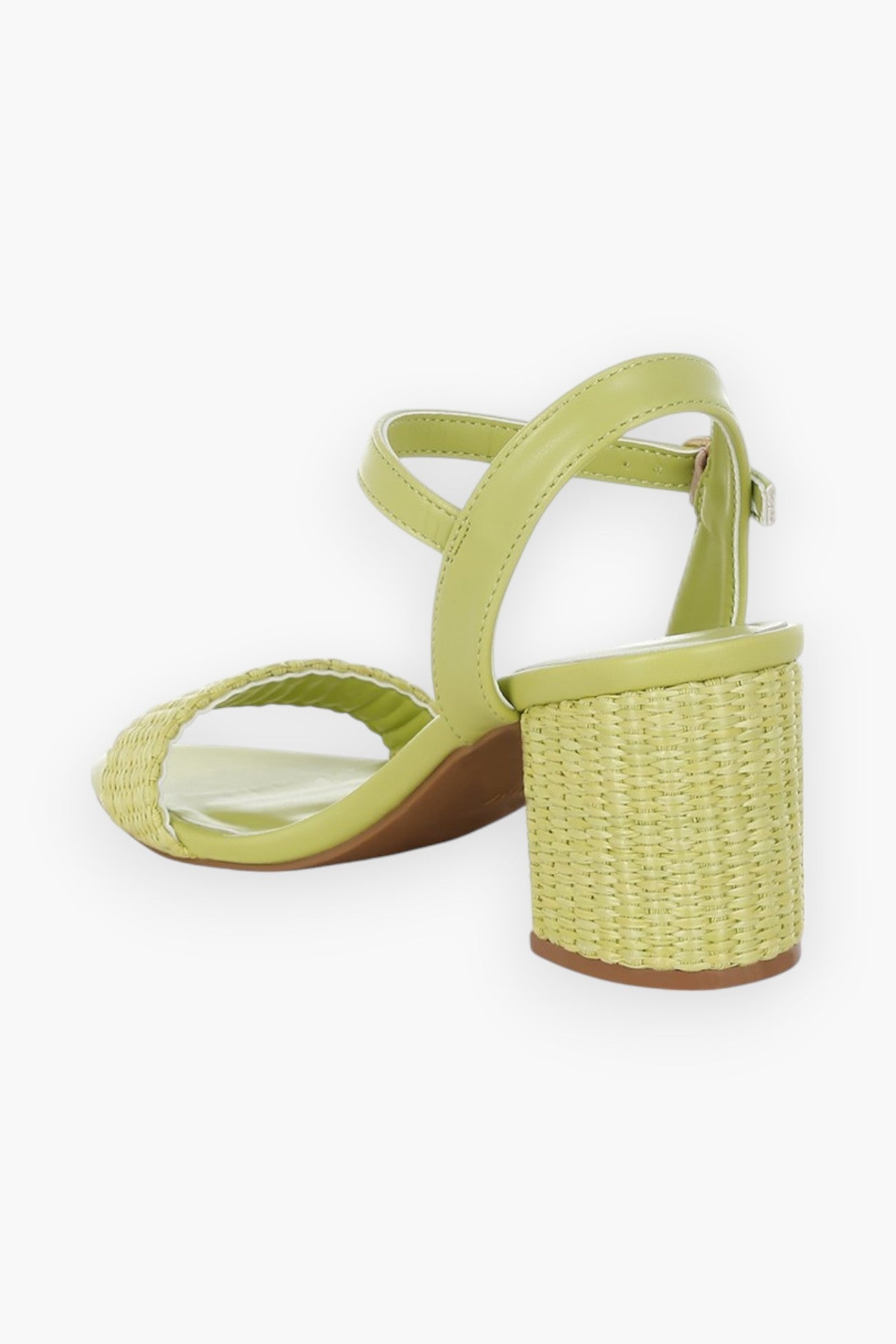 Back angle of green raffia block heel sandals showcasing the textured raffia heel and open-toe design for a breezy summer feel.