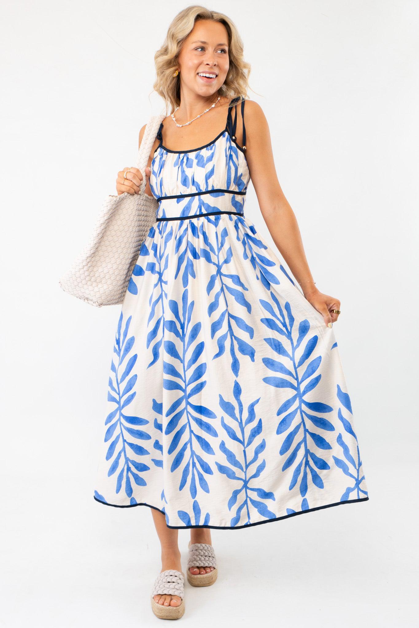 Warmer Days Blue Floral Midi Dress with black contrast stitching and tie sleeves, perfect for a breezy vacation look.