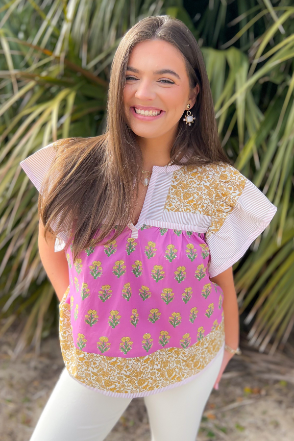 Wildflower Pink & Mustard Printed Ruffle Sleeve Top featuring a floral block print, ruffle sleeves, and a V-neck, perfect for a chic spring look.