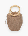 Back view of the Perfect Picnic Tan Straw Bucket Floral Handbag showing natural woven texture and sturdy circular wicker handles.