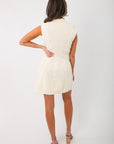 Back view of Marlowe White Mockneck Sweater Dress showing detailed cable knit pattern and clean sleeveless finish.