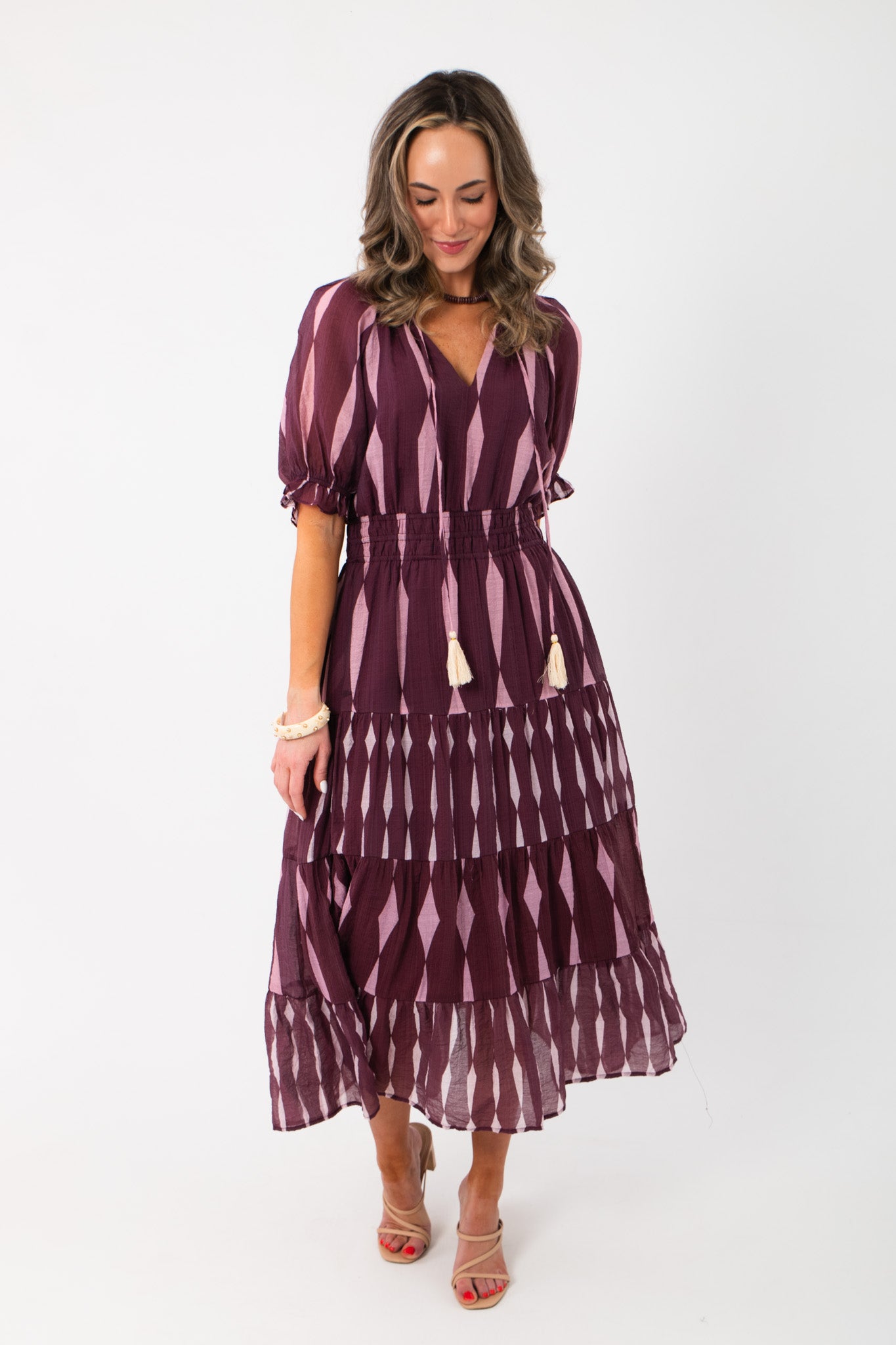 Elegant THML Burgundy & Pink Pattern Maxi Dress featuring elastic cinched waist and flowy midi length, ideal for festive or date night wear.